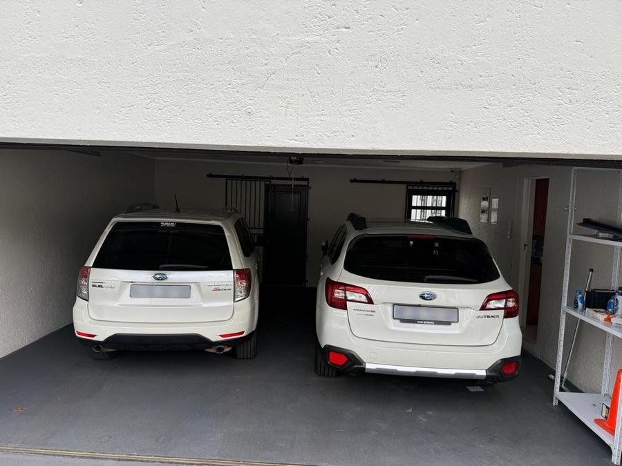 Garage with two Subarus